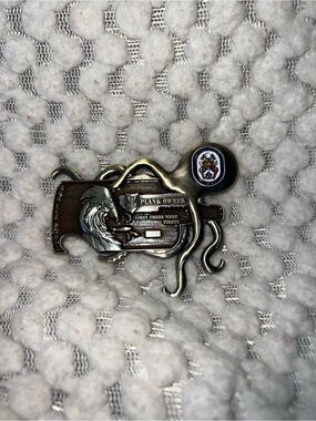 US Navy plank owner belt buckle featuring an octopus anchor design.